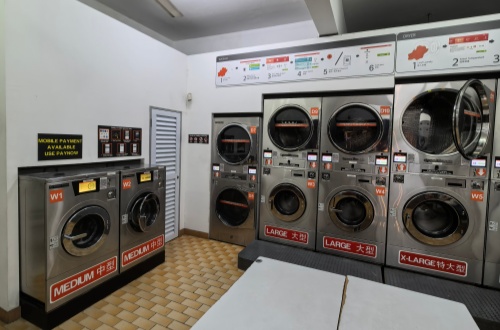 Coin-operated self-service laundromat